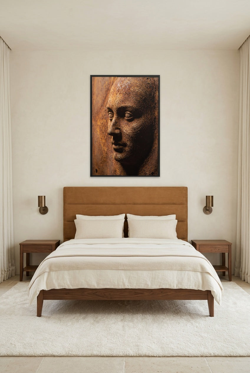 Rust Face — poster in a black frame above a bed