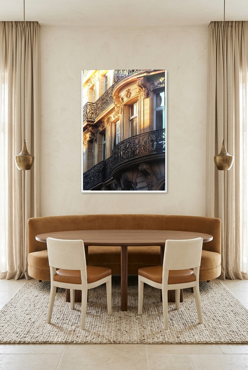 The Haussmann — poster in a white frame above a dining table