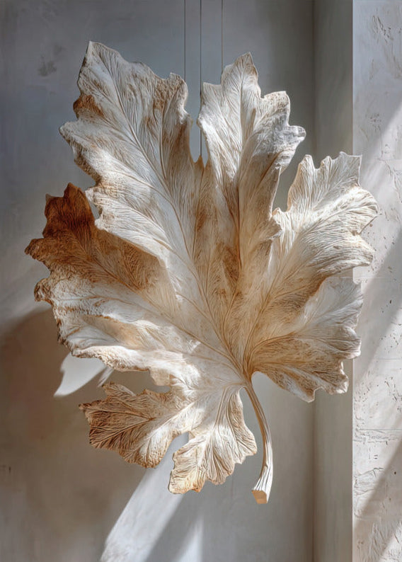 Poster The Fig Leaf — a fig leaf sculpted in cream stone, suspended in the light, size 50 × 70 cm