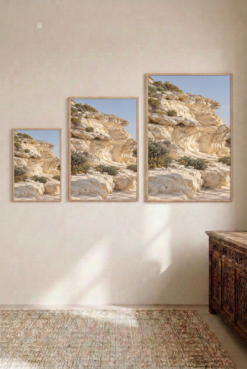 The Sculpted Cliff — three sizes side by side, oak frames
