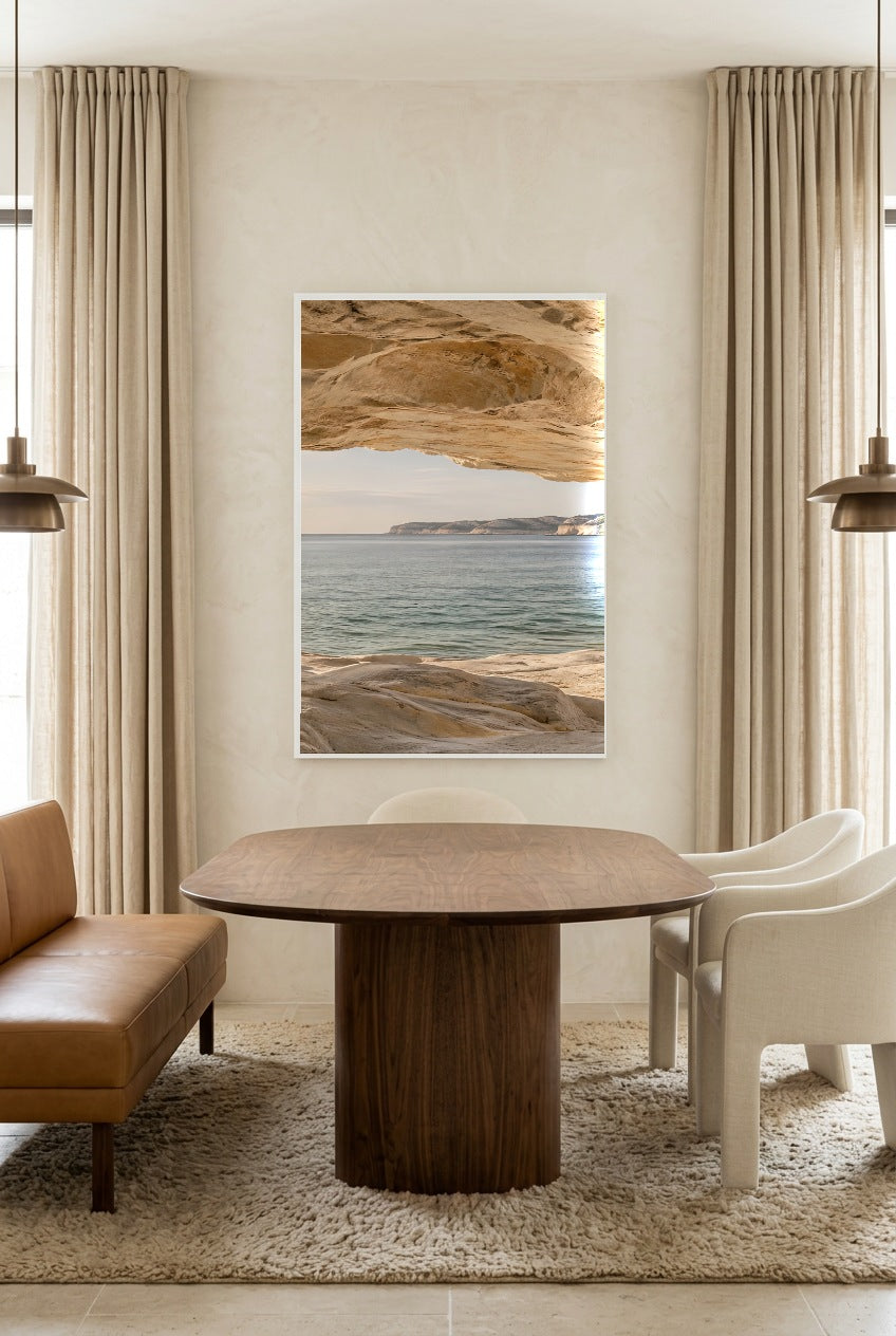 The Horizon beneath the Rock — poster in a white frame above a dining table