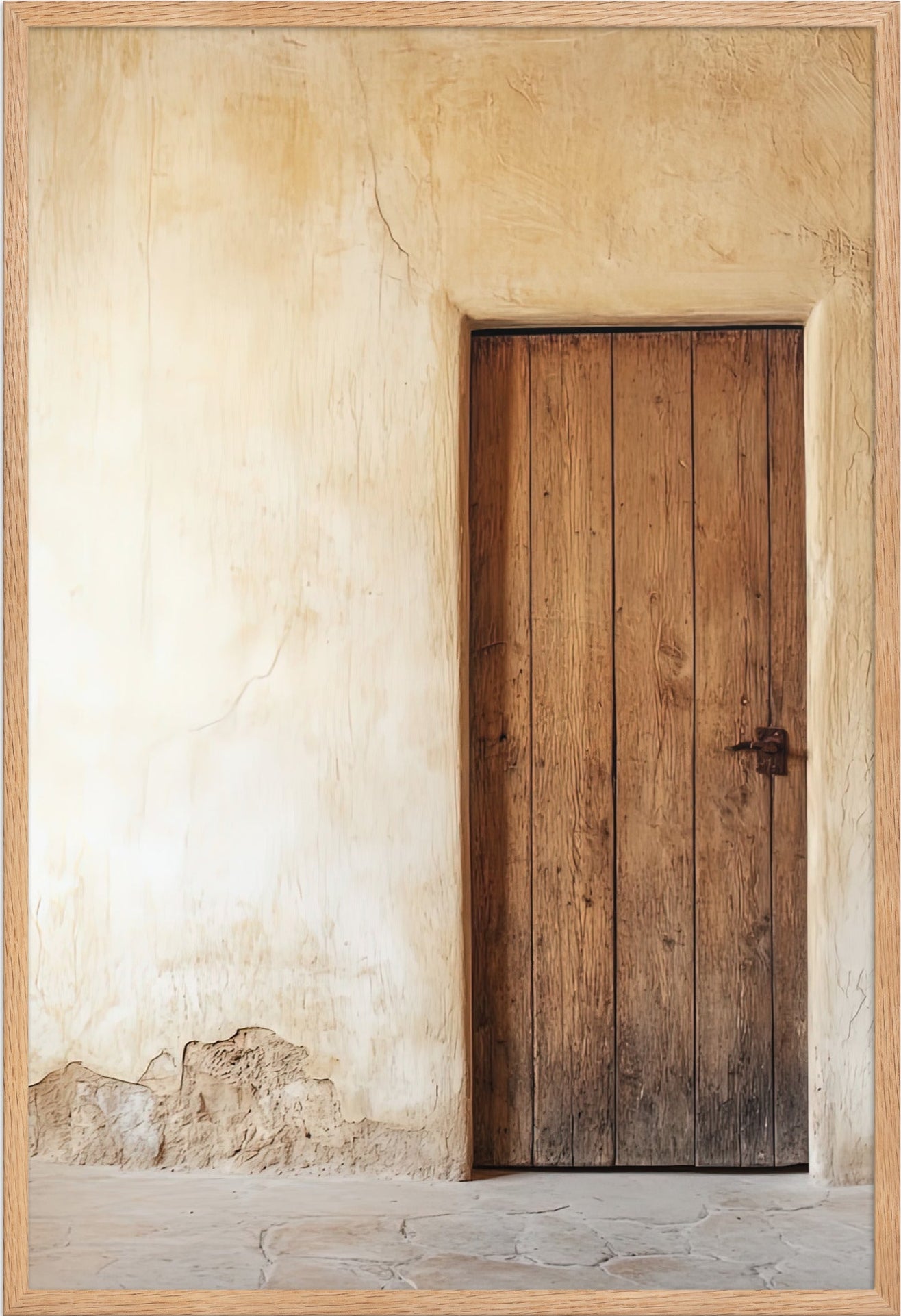 The Andalusian Door poster in a solid oak frame — warm wood door on ivory plaster
