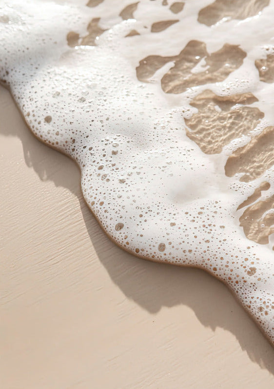 The Wave’s Edge poster on 189 g/m² matte paper — foam and pearly bubbles on ivory beige sand