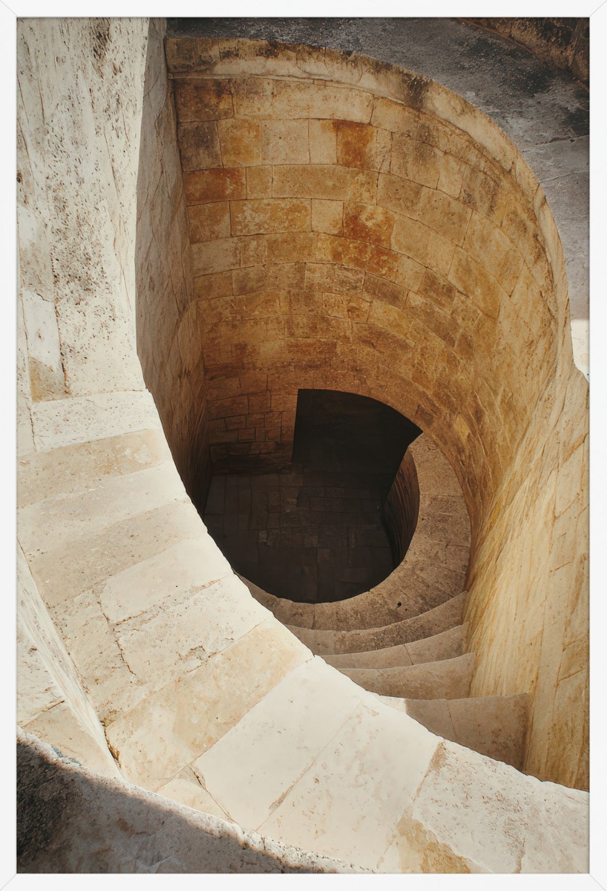 The Descent - Minimalist ivory spiral staircase wall art poster — poster in a white frame, front view