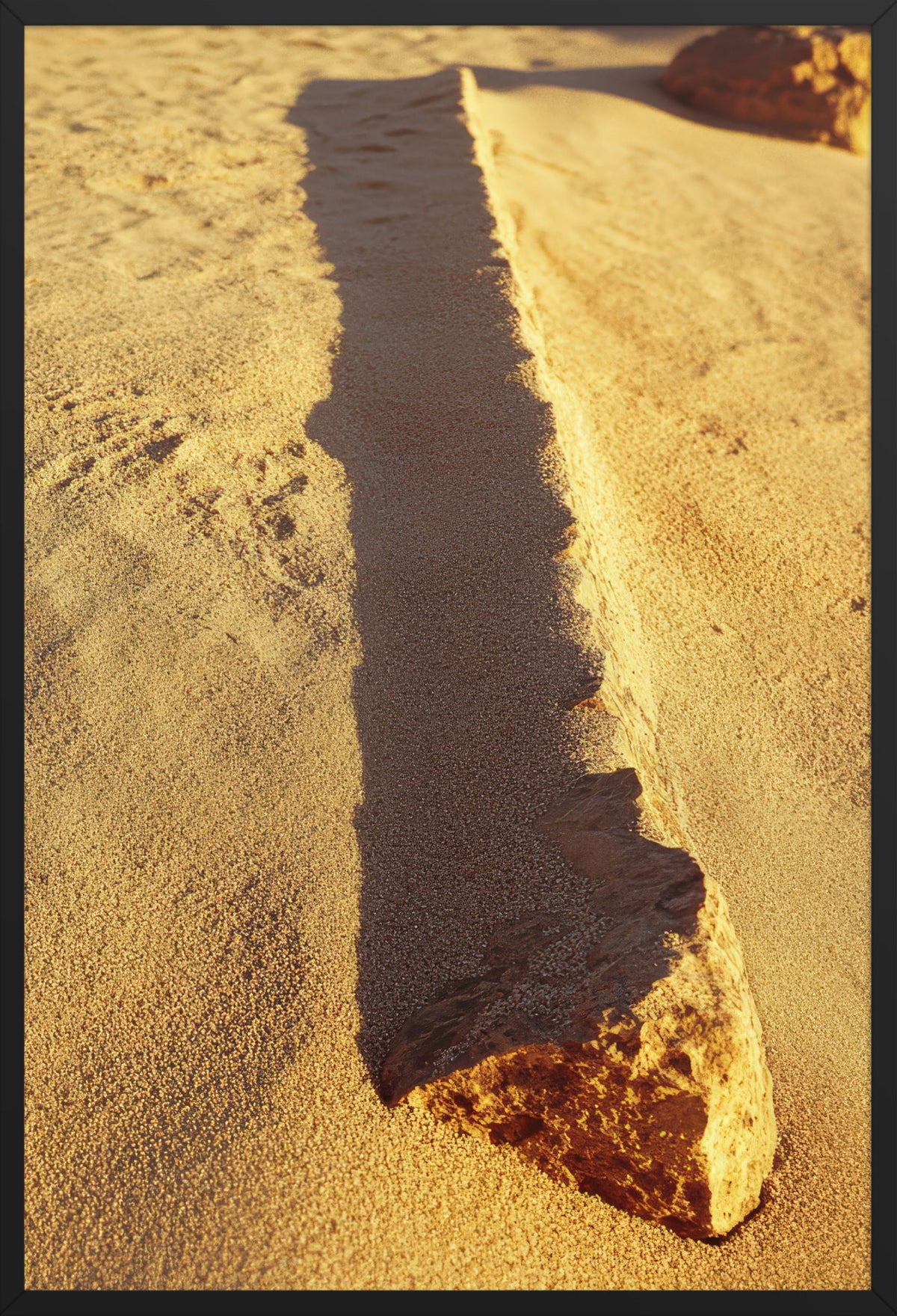 The Shadow of Stone — poster in a black frame, front view