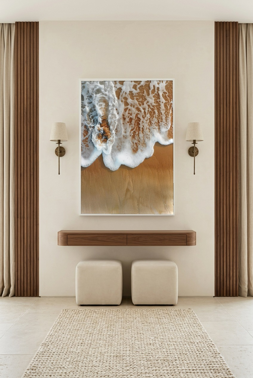 L’Écume Dorée — poster in a white frame in an entryway