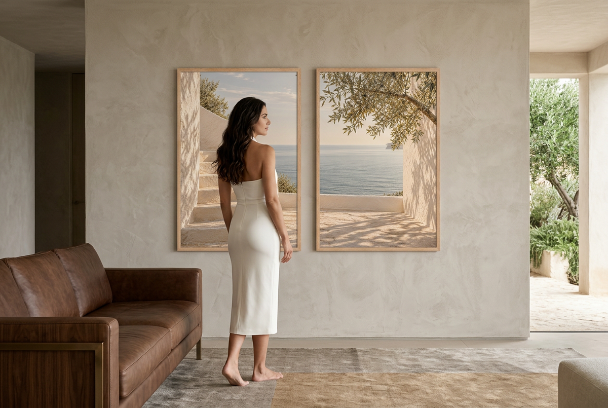 The Terrace by the Sea — wall diptych in oak frames in a living room, with a woman standing
